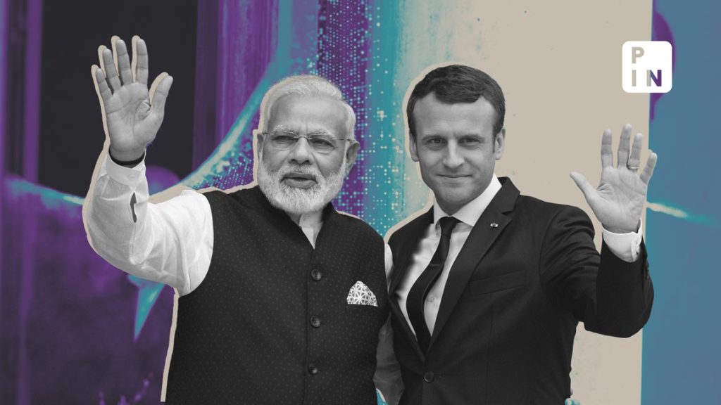 Graphic with text overlay announcing India's co-chair role at the Paris AI Summit, set against a blurred technological background.